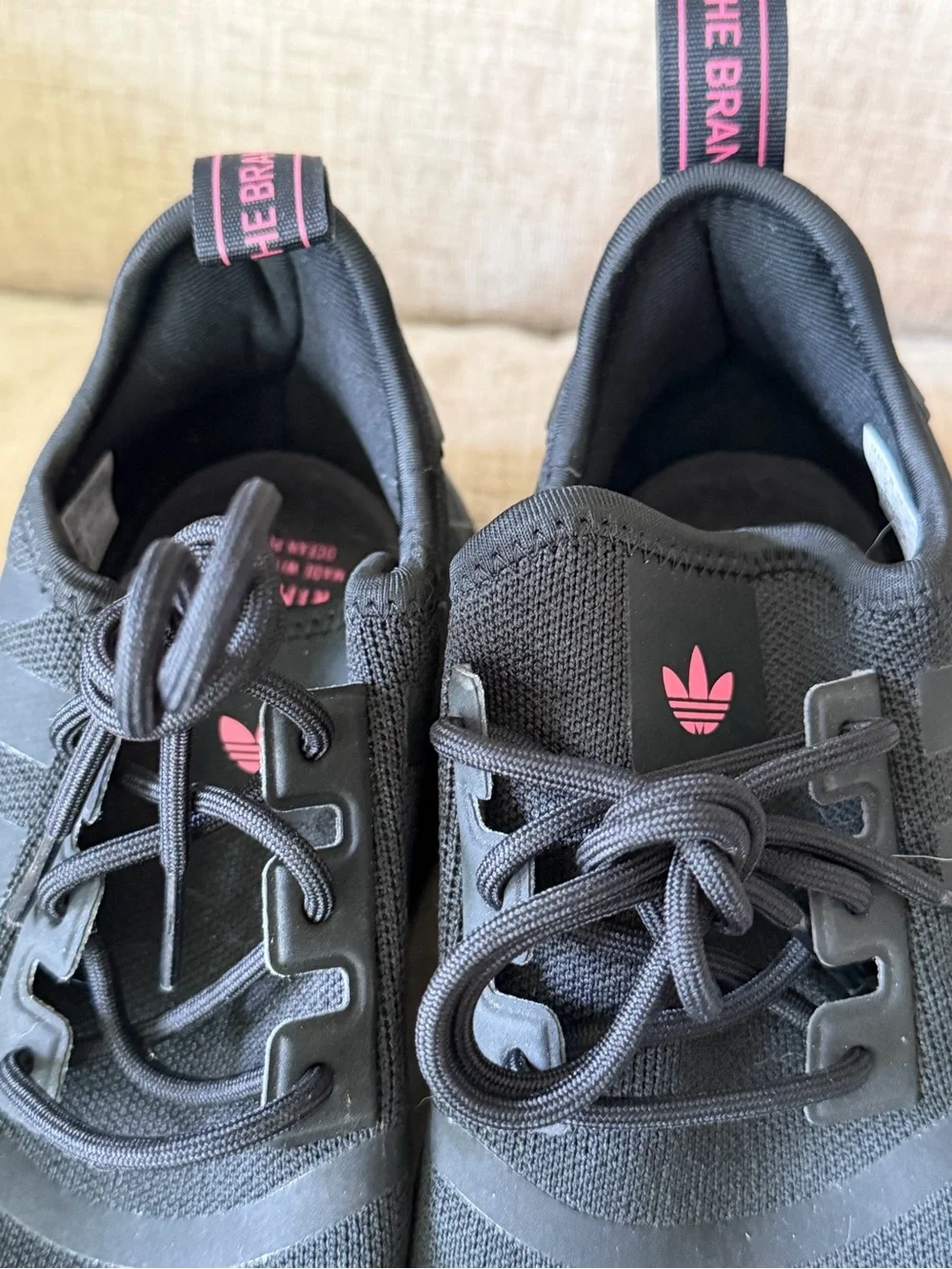 adidas Black PRIMEBLUE NMD R1 Sneakers with Pink Trefoil Accent